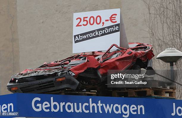 Sign announces the so-called Abwrackpraemie, or scrap-car-incentive, at a car dealership on February 27, 2009 in Berlin, Germany. The German...