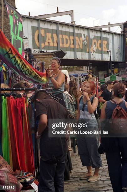 Market vendors display their goods in Camden Lock Market, July 30, 2000 in Camden, London. In 1971 some unwanted industrial buildings and land were...