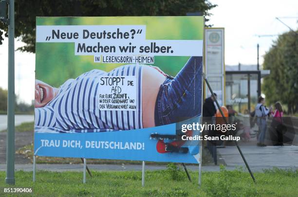 An election campaign billboard of the right-wing Alternative for Germany political party that reads: "New Germans? We'll make them ourselves! Be...