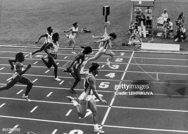 Marlies Goehr crosses the finish line, lane 8 in foreground, 08 August 1983 winning the 100m race at the inaugural Athletics World Championships in...