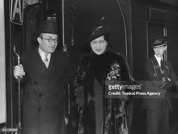 Lithuanian-born British businessman Sir Montague Burton with his wife Lady Burton take the boat-train at Waterloo Station, London, before a cruise on...