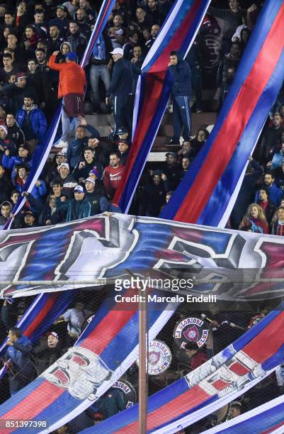 Fans of San Lorenzo cheer for their team during the second leg match between Lanus and San Lorenzo as part of the quarter finals of Copa Conmebol...
