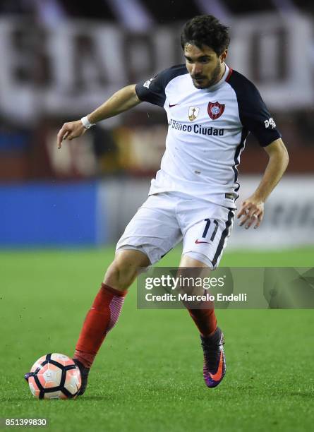 Ezequiel Cerutti of San Lorenzo drives the ball during the second leg match between Lanus and San Lorenzo as part of the quarter finals of Copa...