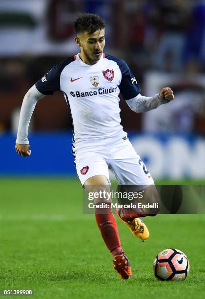 Gabriel Rojas of San Lorenzo drives the ball during the second leg match between Lanus and San Lorenzo as part of the quarter finals of Copa Conmebol...