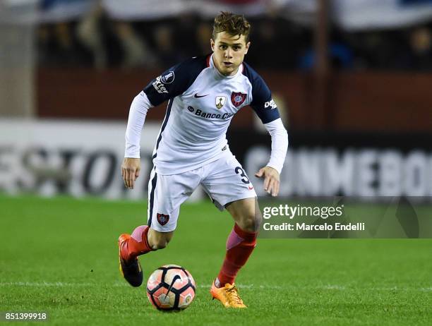 Bautista Merlini of San Lorenzo drives the ball during the second leg match between Lanus and San Lorenzo as part of the quarter finals of Copa...