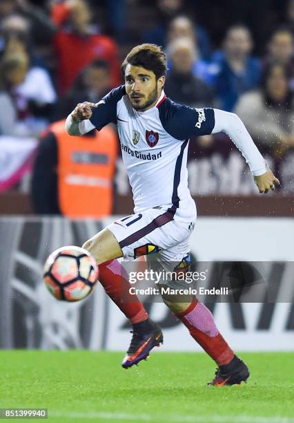 Ezequiel Cerutti of San Lorenzo drives the ball during the second leg match between Lanus and San Lorenzo as part of the quarter finals of Copa...