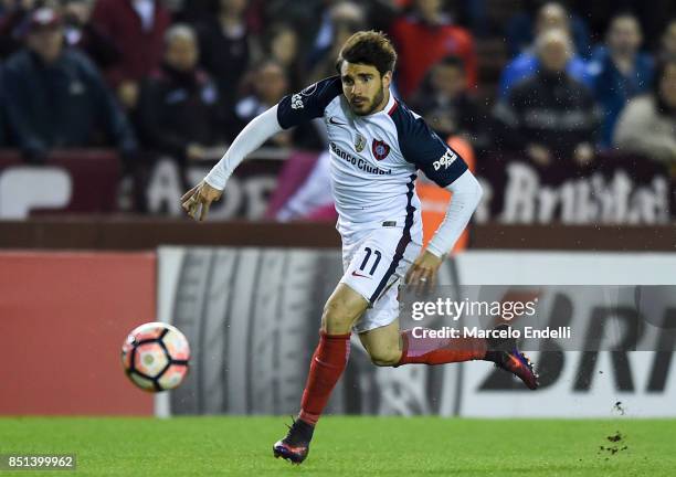 Ezequiel Cerutti of San Lorenzo drives the ball during the second leg match between Lanus and San Lorenzo as part of the quarter finals of Copa...