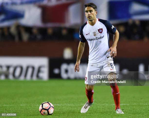 Matias Caruzzo of San Lorenzo drives the ball during the second leg match between Lanus and San Lorenzo as part of the quarter finals of Copa...