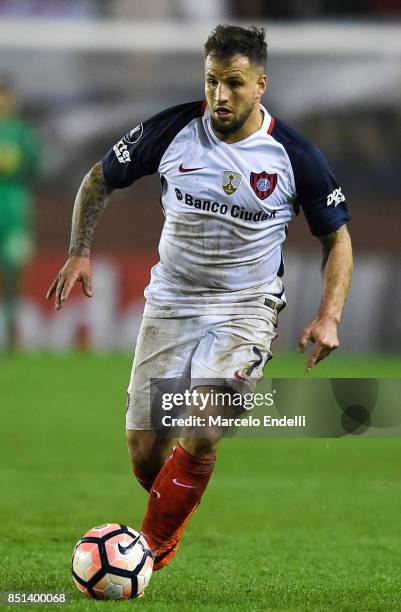 Franco Mussis of San Lorenzo drives the ball during the second leg match between Lanus and San Lorenzo as part of the quarter finals of Copa Conmebol...