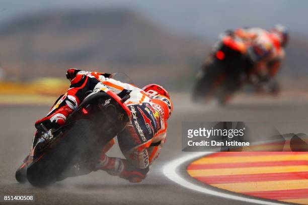 Marc Marquez of Spain and the Repsol Honda Team follows team-mate Dani Pedrosa of Spain and the Repsol Honda Team during practice for the MotoGP of...