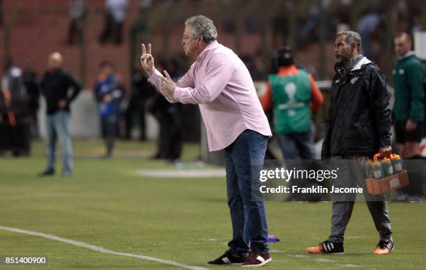 Abel Braga, coach of Fluminense gives instructions to his players during a second leg match between LDU Quito and Fluminense as part of round of 16...