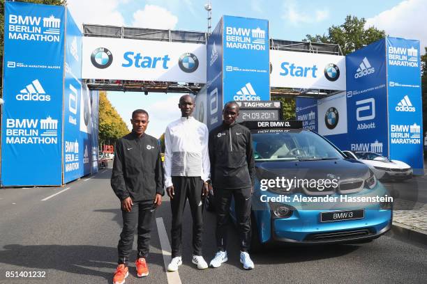 Kenenisa Bekele of Ethiopia, Eliud Kipchoge of Kenia and Wilson Kipsang of Kenya pose at the starting arena for the BMW Berlin Marathon 2017 on...