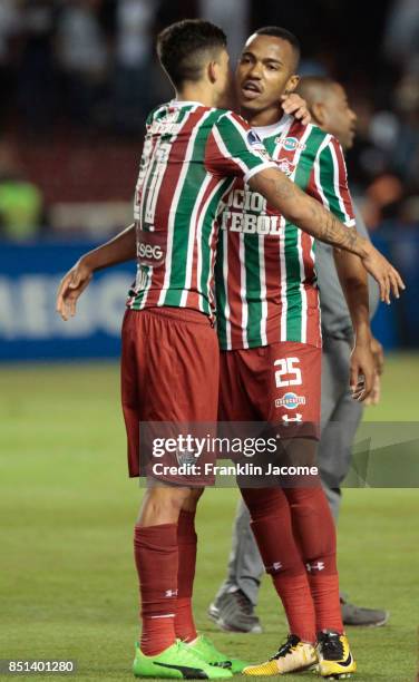 Pedro and Marlon Freitas of Fluminense celebrate their qualification to the quarterfinals after a second leg match between LDU Quito and Fluminense...