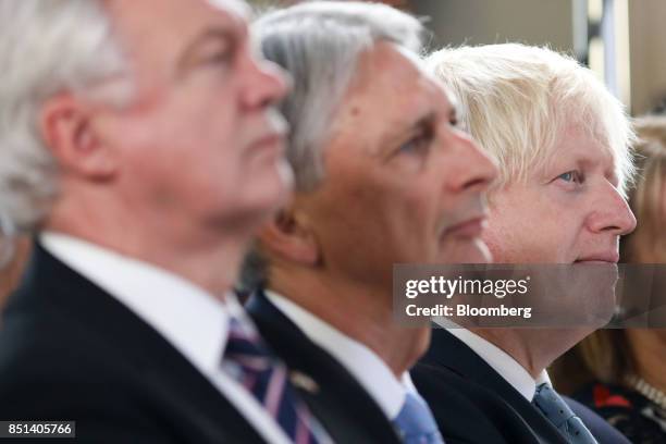 Boris Johnson, U.K. Foreign secretary, right, David Davis, U.K. Exiting the European Union secretary, left, and Philip Hammond, U.K. Chancellor of...