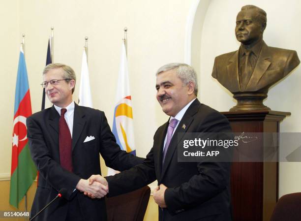 Yves-Louis Darricarrere Divisional President of French oil compnay Total SA shakes hands with President of state-owned Azeri oil company SOCAR Rovnag...