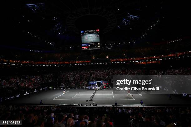 John Isner of Team World plays a backhand during his singles match against Dominic Thiem of Team Europe on the first day of the Laver Cup on...