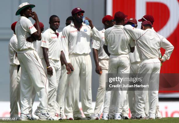 The West Indian team await the Third umpires' decision for the wicket of Kevin Pietersen after a referall, on day 2 of The 4th Test Match between The...