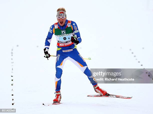 Ville Nousiainen of Finland celebrates as he crosses the line to secure the bronze medal for his team during the Men's Cross Country Relay 4x10KM...
