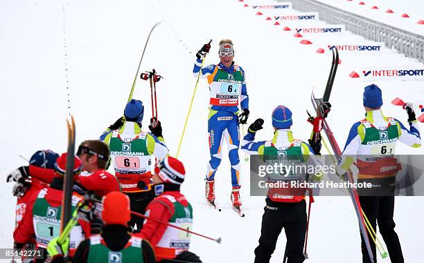 Ville Nousiainen of Finland celebrates as he crosses the line to secure the bronze medal for his team during the Men's Cross Country Relay 4x10KM...