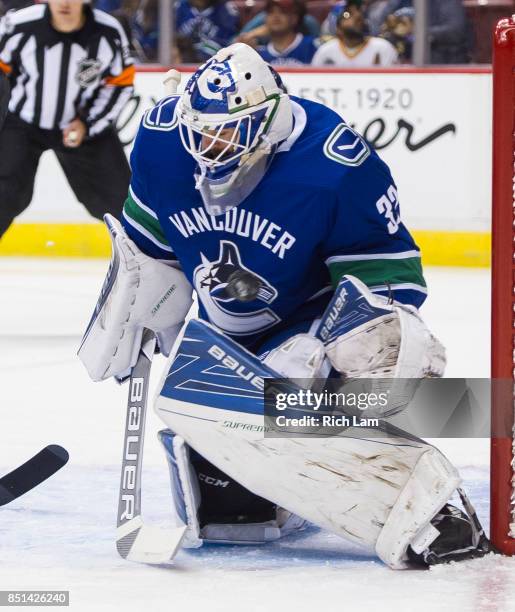 Goalie Richard Bachman of the Vancouver Canucks make a save against the Vegas Golden Knights in NHL pre-season action on September 17, 2017 at Rogers...