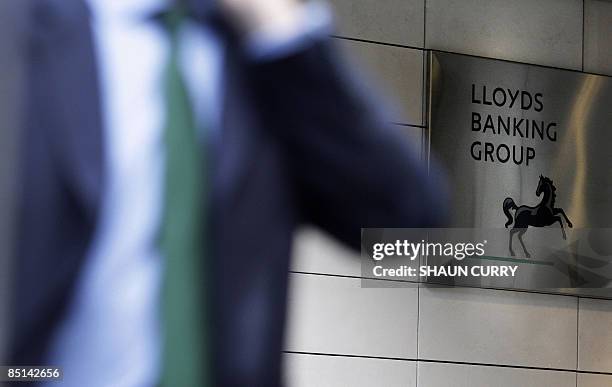 Man walks into the Lloyds Banking Group headquaters in London, on February 27, 2009. Britain's partly-nationalised Lloyds Banking Group said Friday...