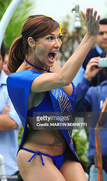 Venezuelan model and actress Catherine Fulop poses for photographers in a pool during the Viña del Mar International Song Festival, on February 27,...