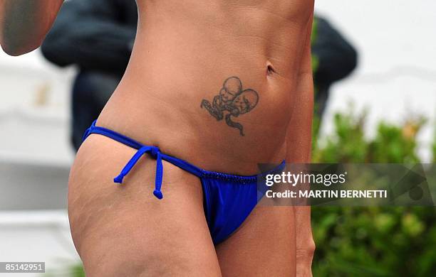 Picture of the tattoos of Venezuelan model and actress Catherine Fulop, taken as she poses for photographers in a pool during the Viña del Mar...