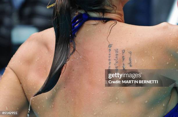 Picture of the tattoos of Venezuelan model and actress Catherine Fulop, taken as she poses for photographers in a pool during the Viña del Mar...