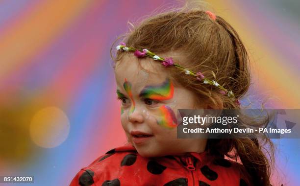 Young girl with her face painted during the second day of the Glastonbury 2013 Festival of Contemporary Performing Arts at Pilton Farm, Somerset.