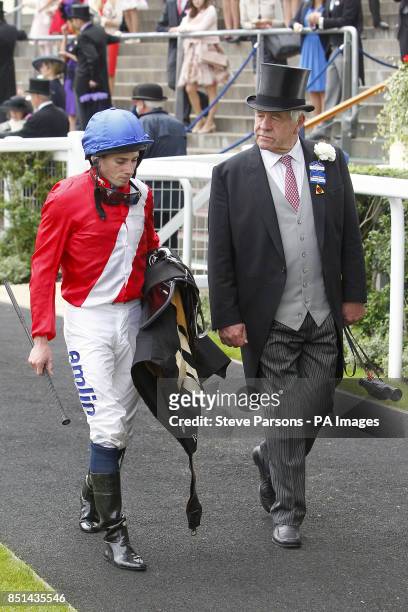 Jockey Ryan Moore and Michael Staite during day five of the Royal Ascot meeting at Ascot Racecourse, Berkshire.
