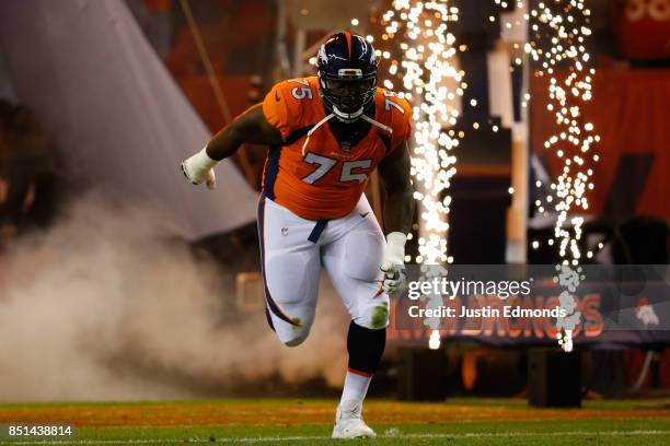 Offensive tackle Menelik Watson of the Denver Broncos is introduced before a game against the Los Angeles Chargers at Sports Authority Field at Mile...