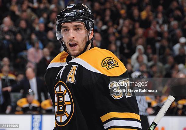 Patrice Bergeron of the Boston Bruins reacts during the game against the Anaheim Ducks at the TD Banknorth Garden on February 26, 2009 in Boston,...