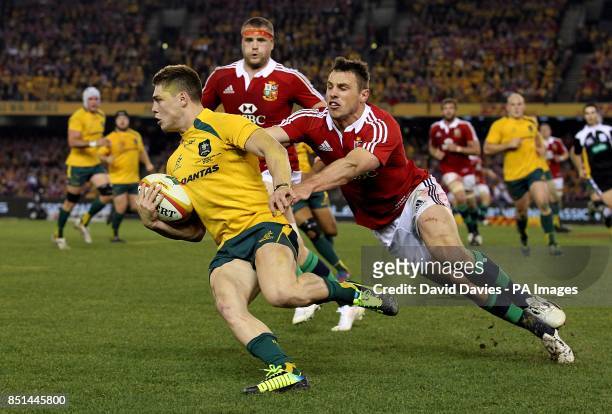 Australia's James O'Connor gets away from British and Irish Lions' Tommy Bowe