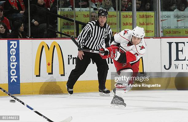 Tim Gleason of the Carolina Hurricanes shoots the puck against the Ottawa Senators at Scotiabank Place on February 24, 2009 in Ottawa, Ontario,...