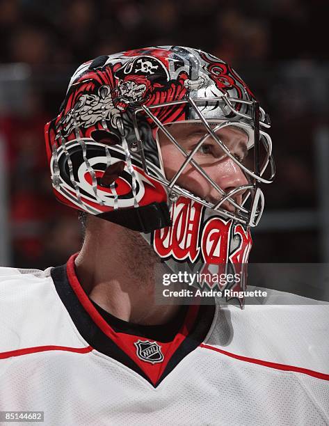 Cam Ward of the Carolina Hurricanes looks on during a stoppage in play against the Ottawa Senators at Scotiabank Place on February 24, 2009 in...