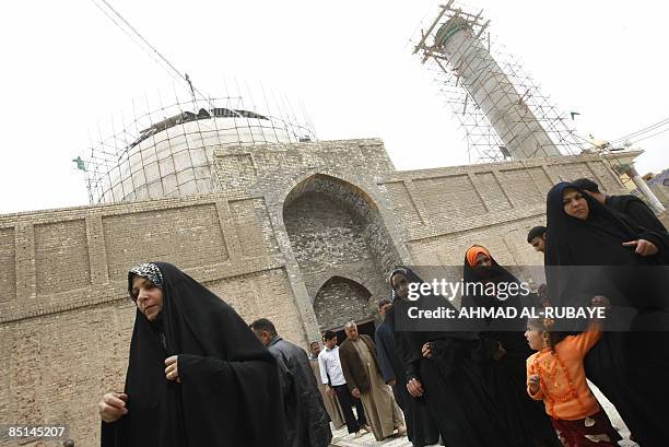 Under repair, pilgrims visit the Al-Askareyya which embraces the tombs of the 10th and 11th Imams, Ali Al-Hadi his son Hassan Al-Askari in the...