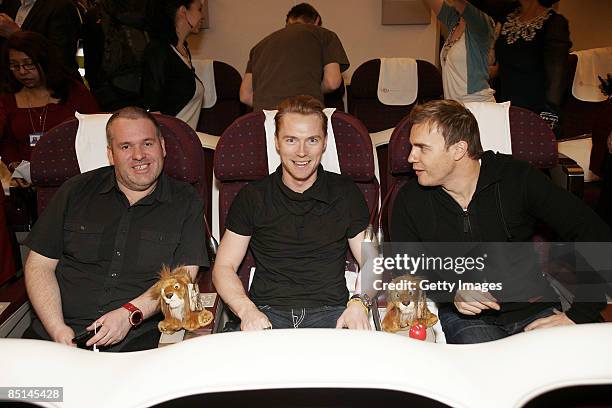 Chris Moyles, Ronan Keating and Gary Barlow pose after boarding a flight with Kenya Airlines to Tanzania to climb Mount Kilimanjaro in aid of Comic...