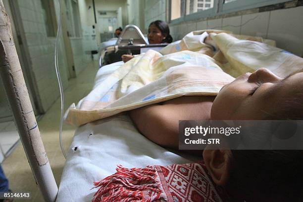 Child affected by dengue lies on bed at hospital in Santa Cruz, eastern Bolivia, on February 27, 2009. In Bolivia's worst national outbreak in a...