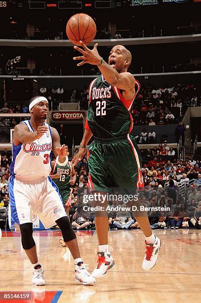 Michael Redd of the Milwaukee Bucks lays the ball up over Ricky Davis of the Los Angeles Clippers during the game on January 17, 2009 at Staples...