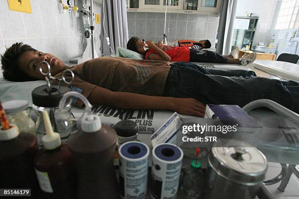 Children affected by dengue lie on their beds at hospital in Santa Cruz, eastern Bolivia, on February 27, 2009. In Bolivia's worst national outbreak...