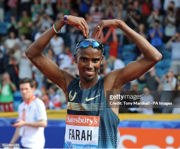 Great Britain's Mo Farah celebrates after winning the Men's 5000m race during day two of the Birmingham Diamond League athletics meeting at the...