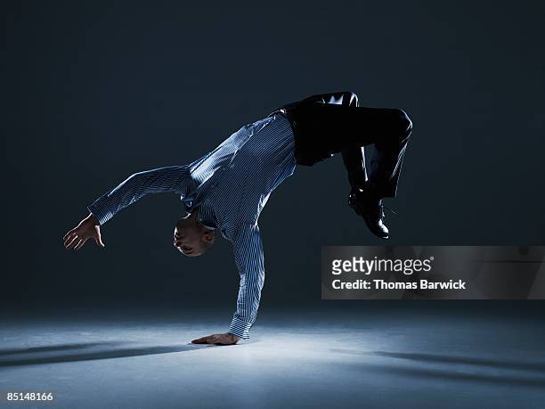 businessman flipping over backwards - flexibilidade fotografías e imágenes de stock
