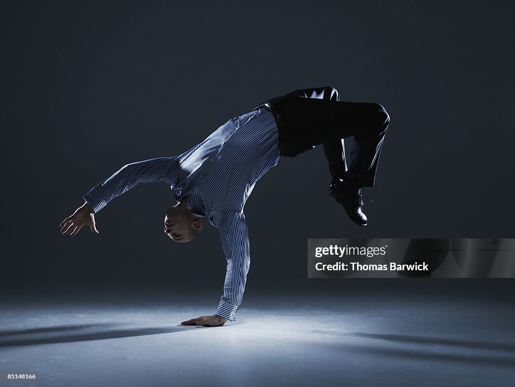 Businessman flipping over backwards