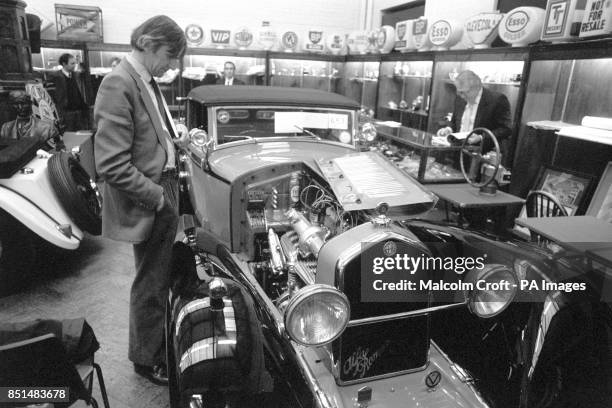 Prospective buyer looks at a 1932 Alfa Romeo 8C 2300. It is going up for auction at Sotherby's Early and Classic Motor Vehicles, Autmobilia and...