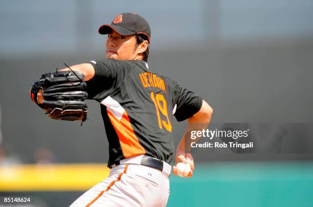 Koji Uehara of the Baltimore Orioles pitches against the Florida Marlins during a spring training game at Roger Dean Stadium on February 27, 2009 in...