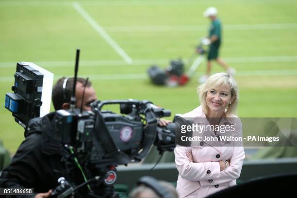 Breakfast weather reporter Carol Kirkwood on centre court prior to doing her piece to camera during day nine of the Wimbledon Championships at The...