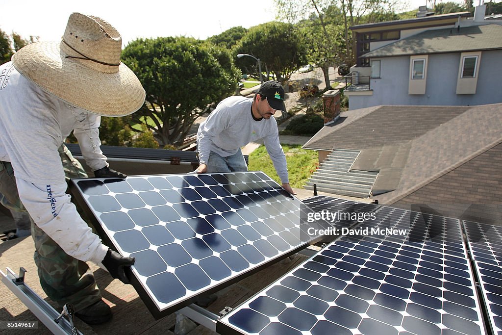 Solar Module Crew Employees of Solar Forward install solar electric panels on a... News ...