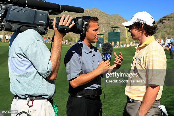 Rory McIlroy of Northern Ireland is interviewed by Steve Sands of The Golf Channel during the third round of the Accenture Match Play Championship at...