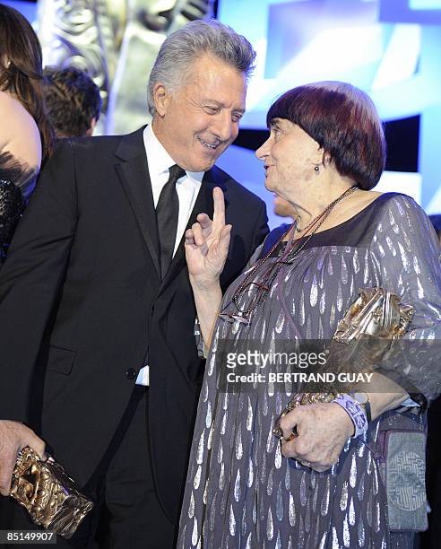 Actor Dustin Hoffman holds his honorary award for his career in acting and talks to French director Agnes Varda who won the award for best...