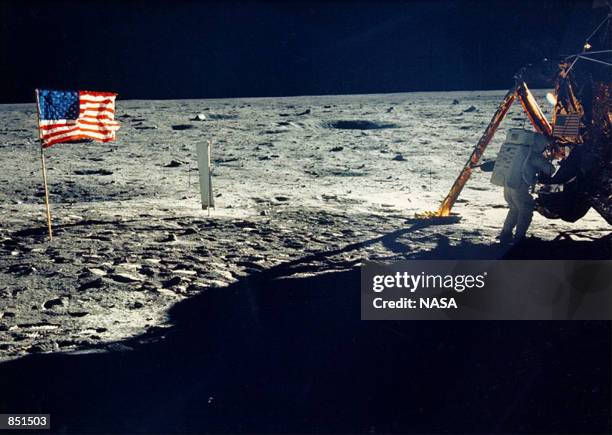 One of the few photographs of Neil Armstrong on the moon shows him working on his space craft on the lunar surface. The 30th anniversary of the...